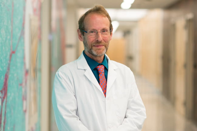 Timothy J. Lyons, M.D. standing in hallway
