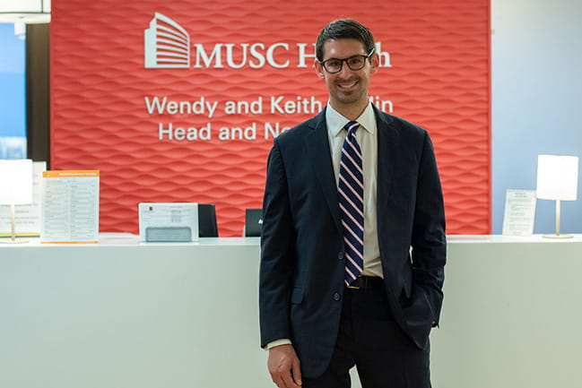 Evan Graboyes, M.D., poses in an operating room
